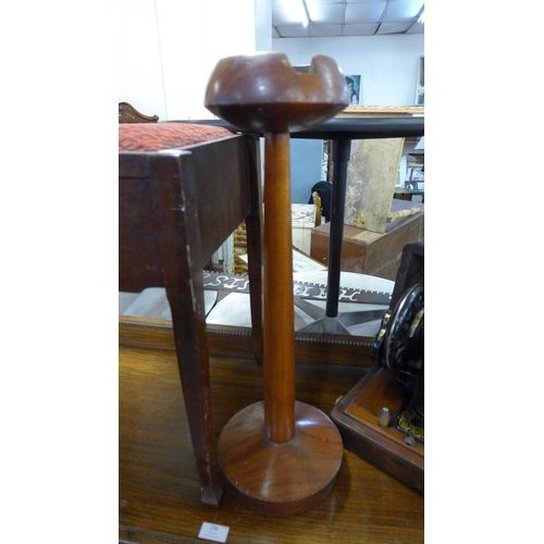 245 - A mahogany piano stool, a smokers stand and a Singer sewing machine