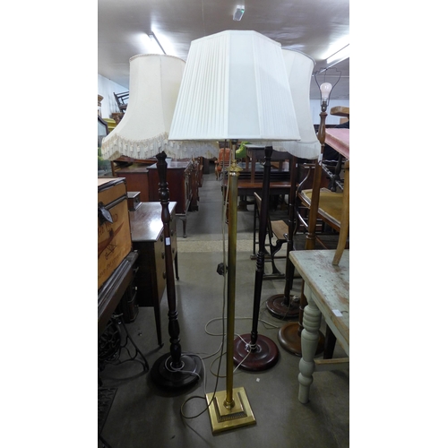 247 - A brass standard lamp and two beech standard lamps