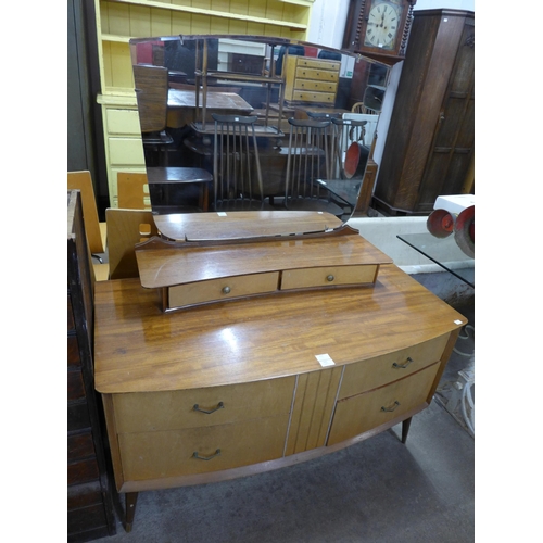 255 - A walnut and birds eye maple dressing table