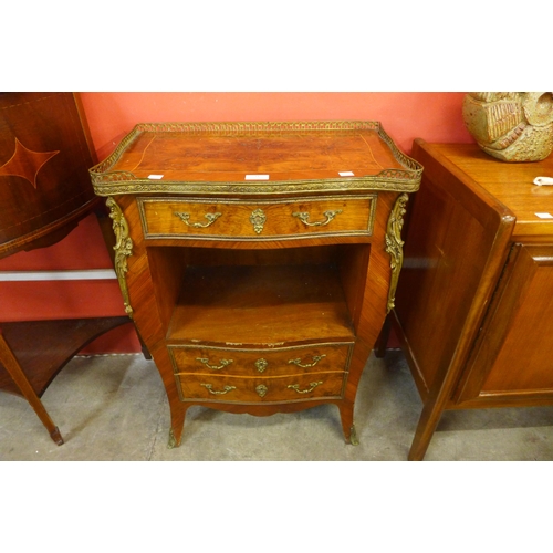 31 - A French Louis XV style inlaid walnut and gilt metal mounted bombe shaped petit commode