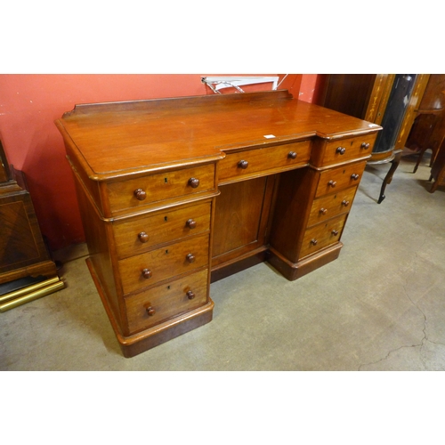 34 - A Victorian mahogany kneehole desk