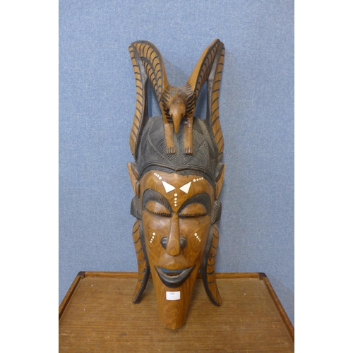 398 - An African carved hardwood wall hanging face mask