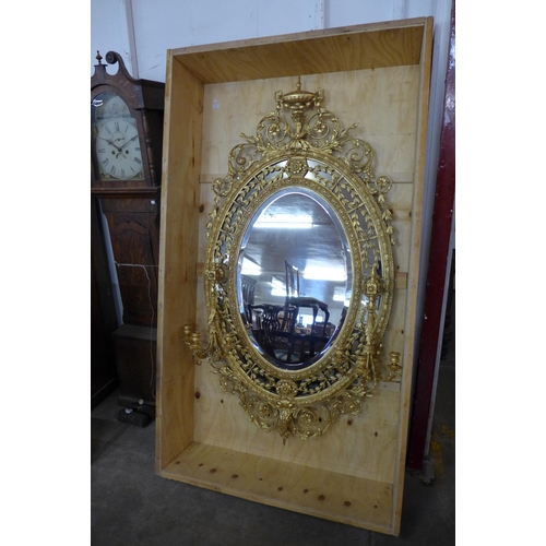 41 - A large Regency giltwood and gesso girandole mirror, 176 x 105 cms