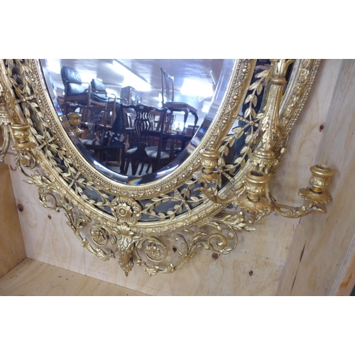 41 - A large Regency giltwood and gesso girandole mirror, 176 x 105 cms