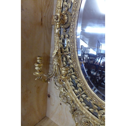 41 - A large Regency giltwood and gesso girandole mirror, 176 x 105 cms