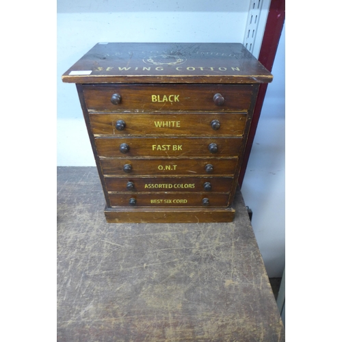 422 - A Victorian stained pine counter top shop cabinet, bearing J&P Coats Limited inscription