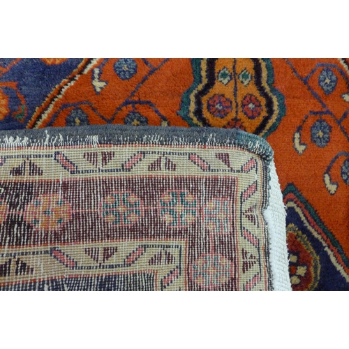 47 - A hand knotted North West Iranian red ground runner rug, 314 x 132cms