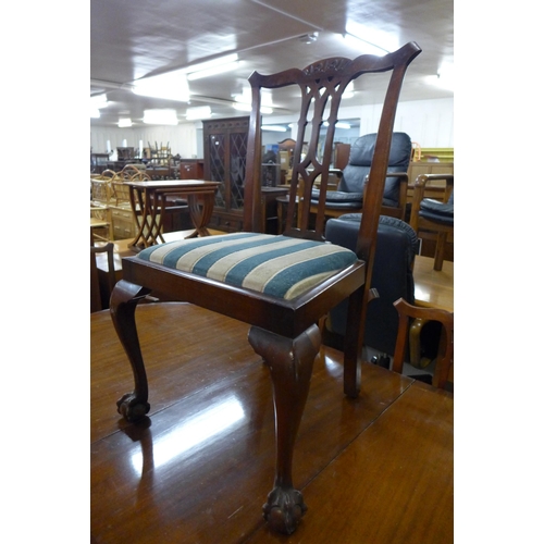 51 - A Regency style mahogany pedestal dining table and seven Chippendale style dining chairs