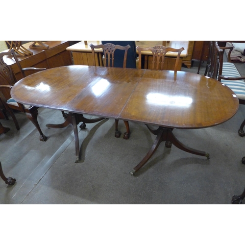 51 - A Regency style mahogany pedestal dining table and seven Chippendale style dining chairs