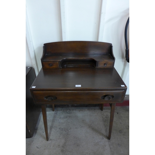 60 - An Ercol dark elm and beech 479 model writing desk