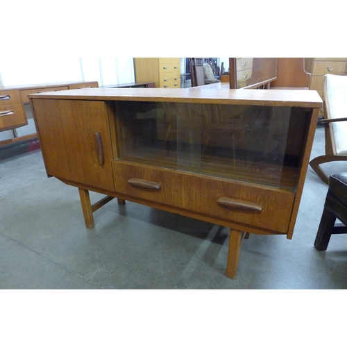 69 - A small teak sideboard