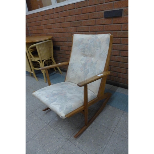 70 - A Danish Kubus Boomerang teak rocking chair, model no. 97, designed by Georg Jensen