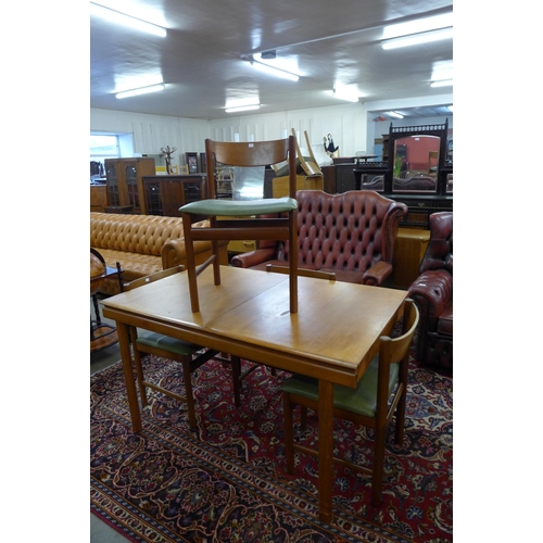 78 - A White & Newton teak extending dining table and four chairs