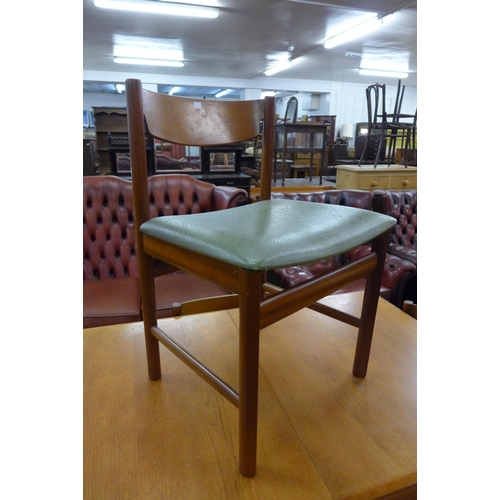 78 - A White & Newton teak extending dining table and four chairs