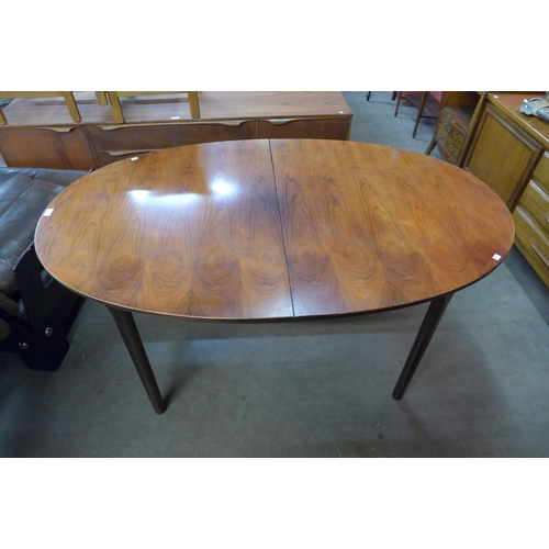 89 - A McIntosh rosewood extending dining table, 74cms h, 153cms l, 95cms w 

*Accompanied by CITES A10 c... 