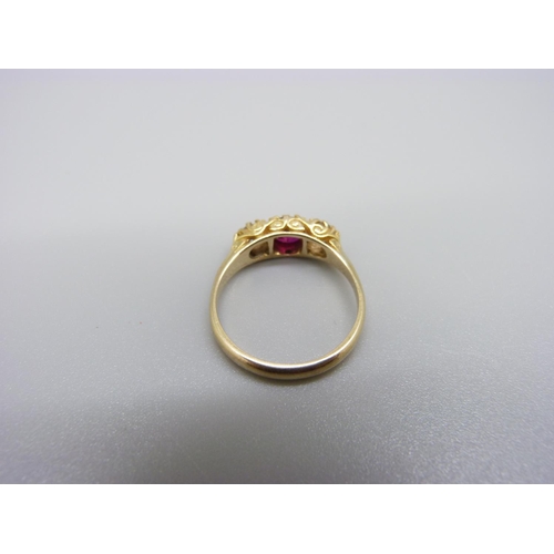 1002 - A 9ct gold, ruby and white stone ring, 2.8g, O