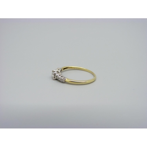 1004 - An 18ct gold and seven stone diamond ring, 0.25ct diamond weight, 1.8g, M