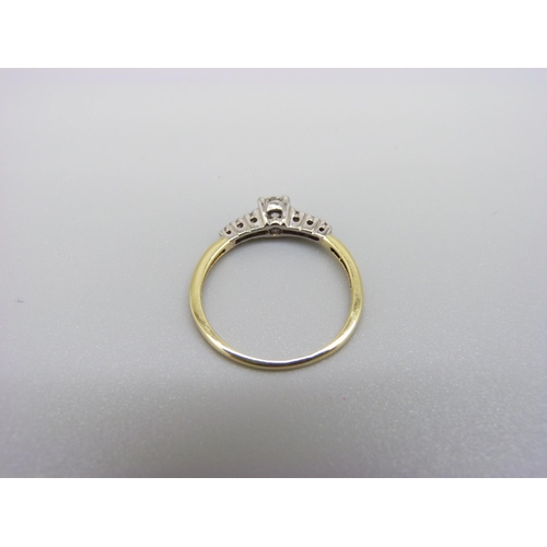 1004 - An 18ct gold and seven stone diamond ring, 0.25ct diamond weight, 1.8g, M