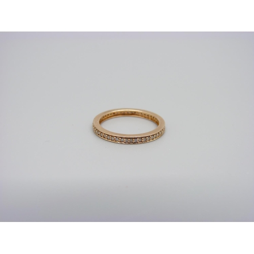 1005 - An 18ct gold and diamond full eternity ring, 1.9g, M, marked 750