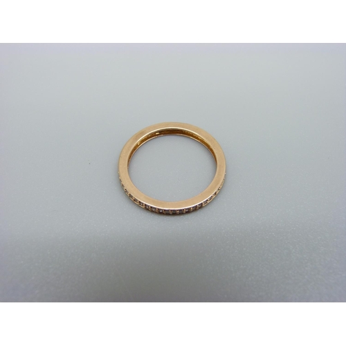 1005 - An 18ct gold and diamond full eternity ring, 1.9g, M, marked 750