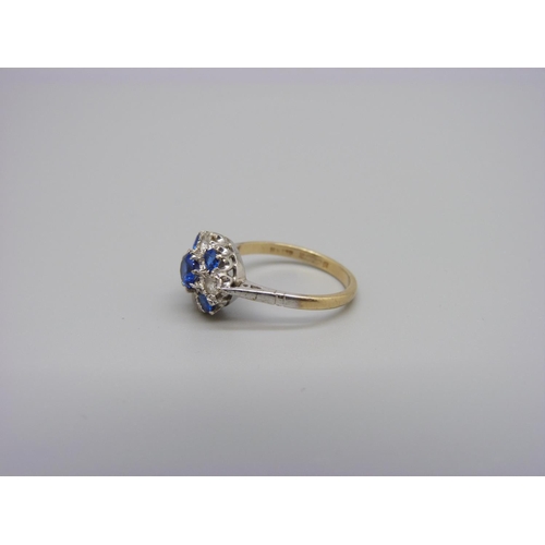 1010 - A 9ct gold and platinum set white and blue stone ring, 2.6g, N