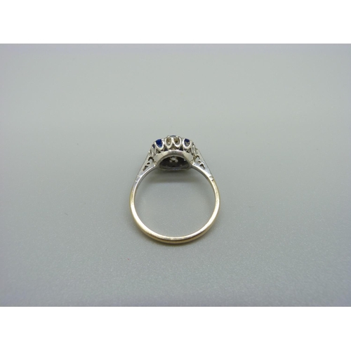 1010 - A 9ct gold and platinum set white and blue stone ring, 2.6g, N