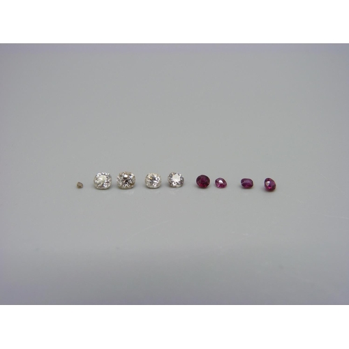 1025 - Four old cut diamonds, approximately 1 carat weight, and four small rubies