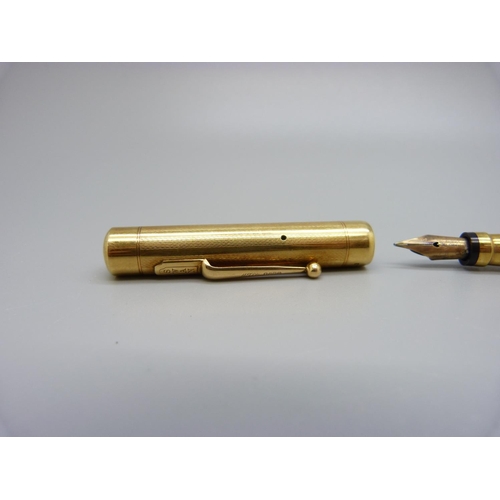 1027 - An 18ct gold Swan pen with 14ct gold nib, personalised, total weight 35.9g