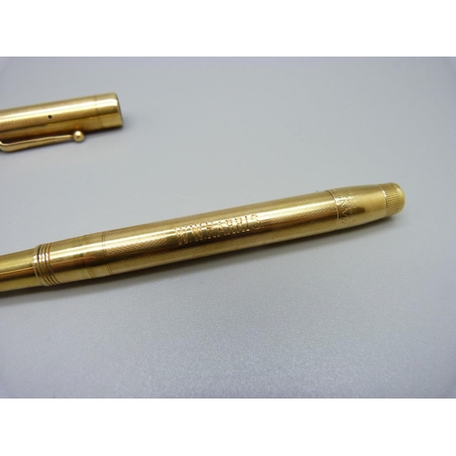 1027 - An 18ct gold Swan pen with 14ct gold nib, personalised, total weight 35.9g