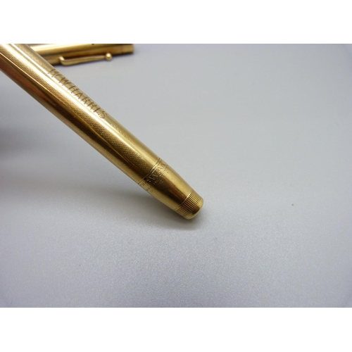 1027 - An 18ct gold Swan pen with 14ct gold nib, personalised, total weight 35.9g