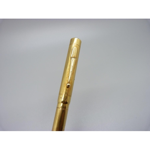 1027 - An 18ct gold Swan pen with 14ct gold nib, personalised, total weight 35.9g