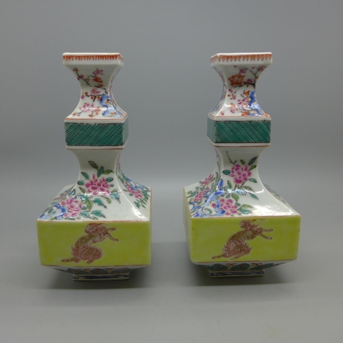 629 - A pair of Chinese porcelain square section vases, 15cm