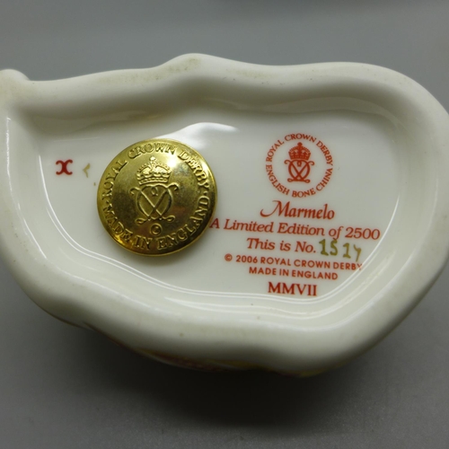 635 - A Royal Crown Derby limited edition Marmelo paperweight with gold stopper and certificate, 879/2500,... 