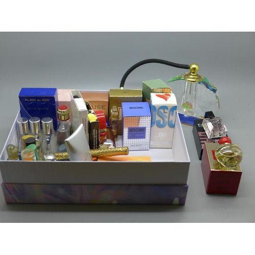 636 - A collection of miniature perfumes with an atomiser