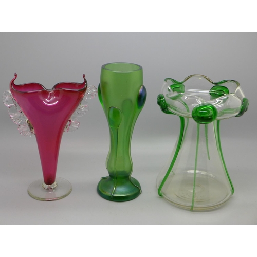 638 - Three vases, circa 1900, cranberry posy vase, 17cm, an Art Nouveau iridescent green glass vase, 17cm... 