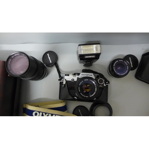 757 - A collection of camera equipment, Olympus OM10 35mm with manual adaptor and 50mm lens, 28mm wide ang... 