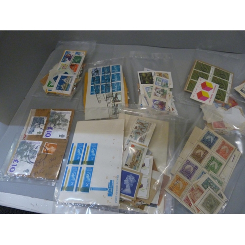 814 - A collection of stamps, loose and in albums, including a Cape triangle and a collection of first day... 