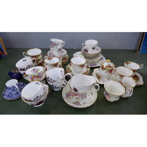 829 - A part Royal Albert Old Country Roses tea set, Royal Albert Michaelmas Daisy tea ware and a Colcloug... 