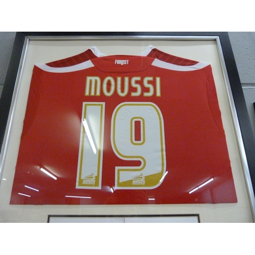 866 - A match worn Nottingham Forest football shirt, worn by no.19 Guy Moussi, mounted with picture and si... 