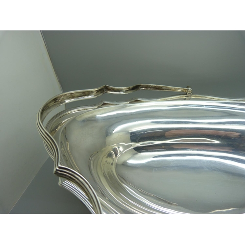 890 - A silver basket centrepiece with handle, 844g, 33cm