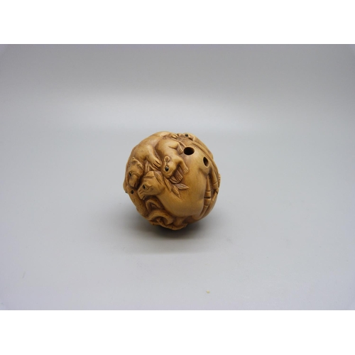 910 - A carved Zodiac ball