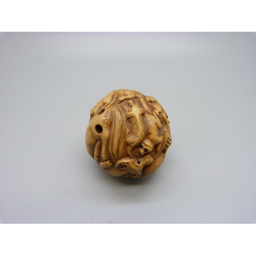 910 - A carved Zodiac ball