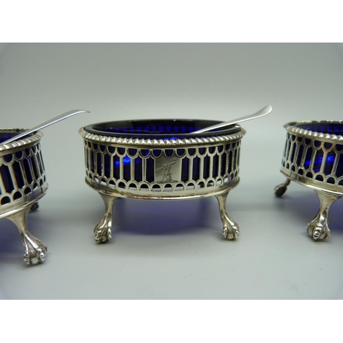 920 - Four silver salts with blue glass liners, London 1772, and four silver spoons, (2+2), 197g