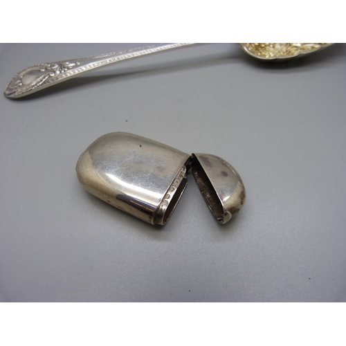 923 - A silver berry spoon, Walker & Hall, and a Victorian silver vesta case, (hinge strained), 112g