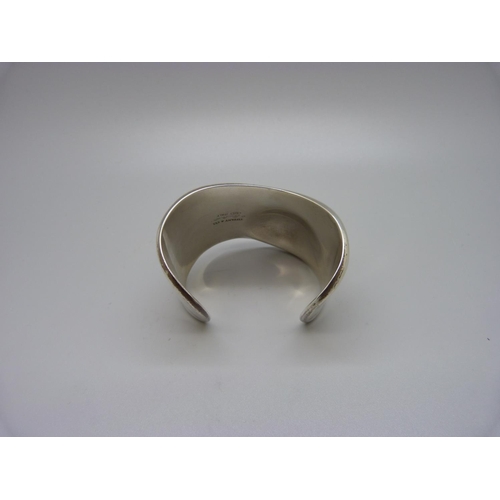 932 - A silver Tiffany & Co. 'bone' cuff bangle by Elsa Peretti, 83.7g, opening 32mm