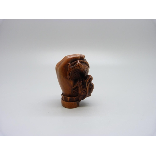 944 - A netsuke, hand with dragon