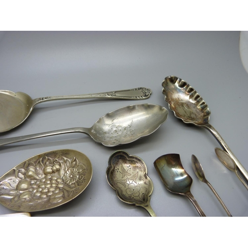 953 - A silver berry spoon, 104g, other spoons, etc.