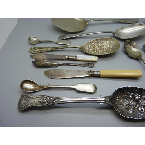 953 - A silver berry spoon, 104g, other spoons, etc.