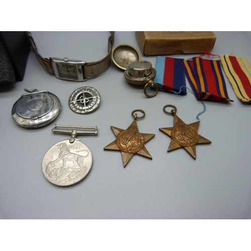 976 - Three WWII medals, two wristwatches, a small silver compact lacking mirror, sovereign case, a/f, and... 