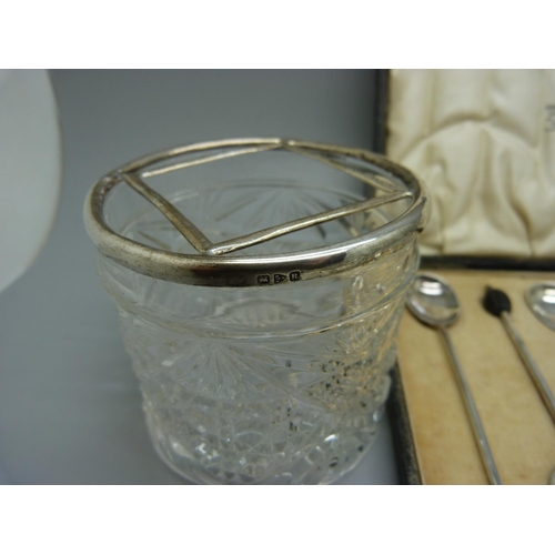 979 - Six silver coffee bean spoons, 50g, a silver handled pickle fork and a silver mounted glass jar